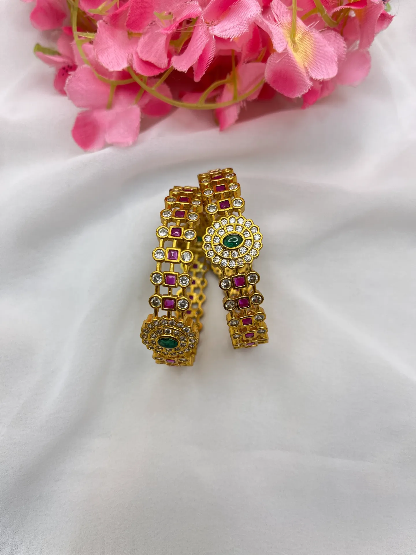 Luxurious gold bangles on pink silk-B76